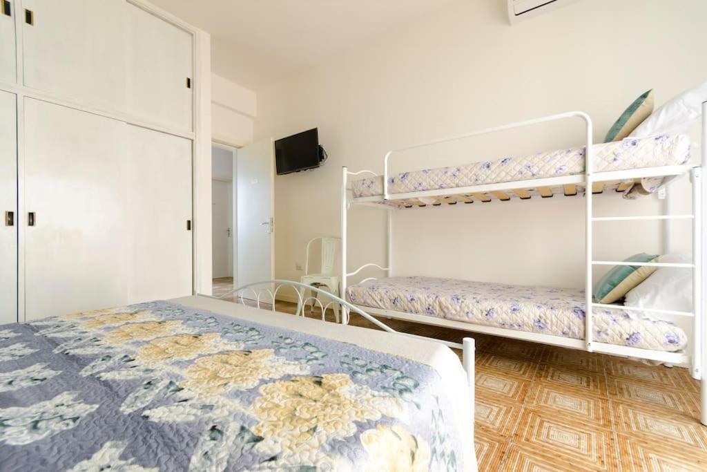 Postel nebo postele na pokoji v ubytování Casa Mariù