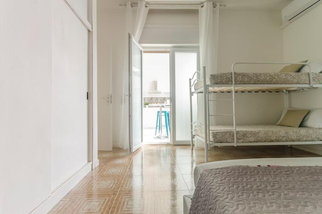 Postel nebo postele na pokoji v ubytování Casa Mariù