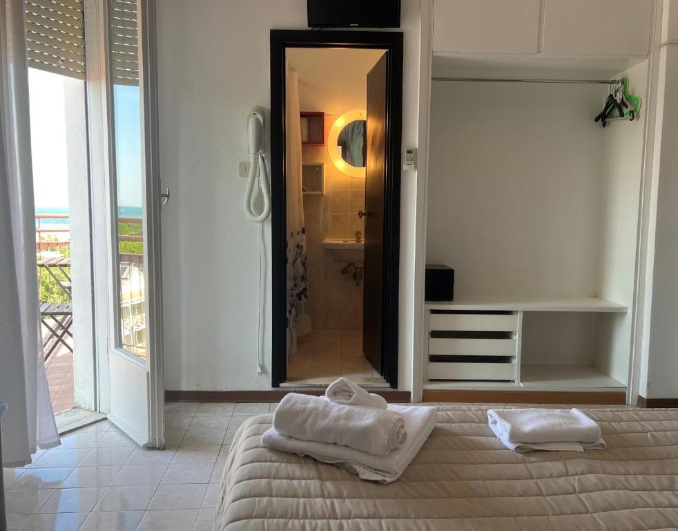 Postel nebo postele na pokoji v ubytování X Hotel