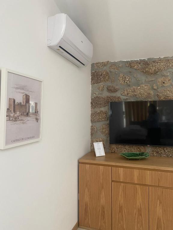 TV a/nebo společenská místnost v ubytování CASA DAS QUINTÃES