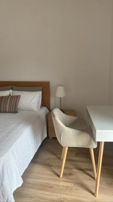 Postel nebo postele na pokoji v ubytování CASA DAS QUINTÃES