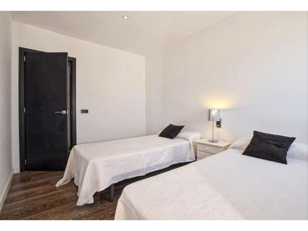 A bed or beds in a room at Belvilla by OYO Son Baulo