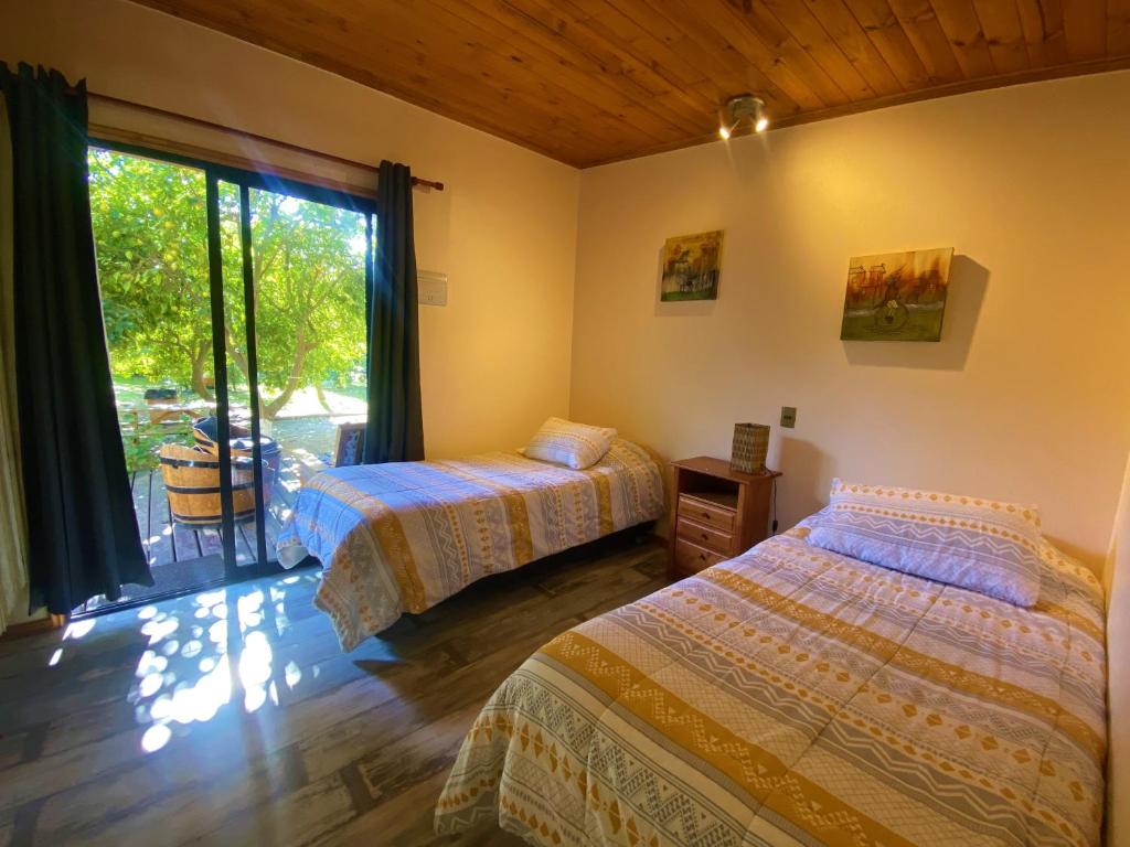 Postel nebo postele na pokoji v ubytování Cabañas SPA Olmue