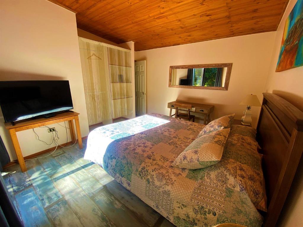 Postel nebo postele na pokoji v ubytování Cabañas SPA Olmue