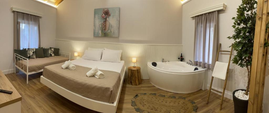 Postel nebo postele na pokoji v ubytování Goninos Jacuzzi Suite