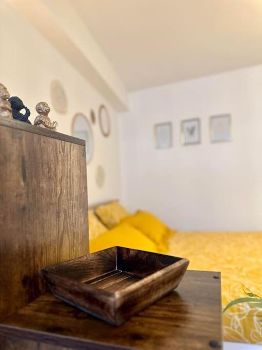 a wooden box sitting on top of a table at Appartement neuf entièrement équipé proche centre in Amiens