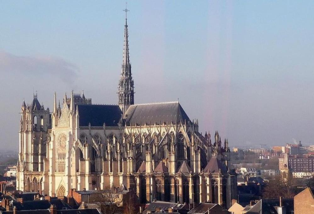 a large building with a clock tower on top of it at Appartement neuf entièrement équipé proche centre in Amiens