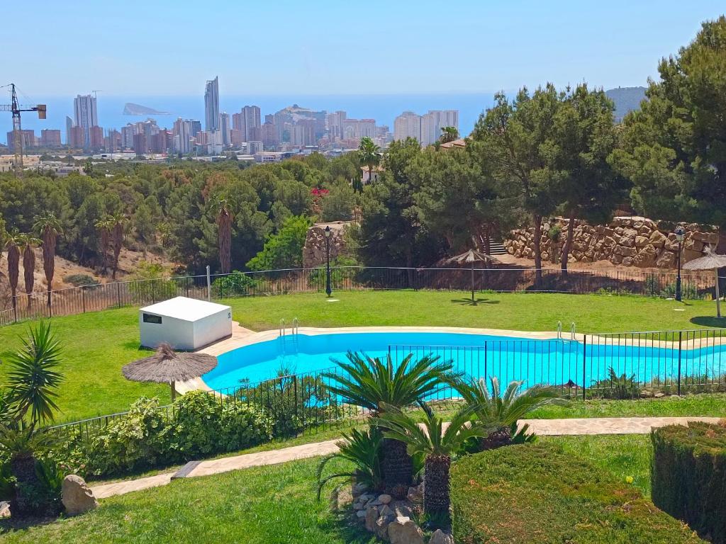 a swimming pool with a view of the city at Bahia Vista - Chalet adosado con vista al mar in Finestrat