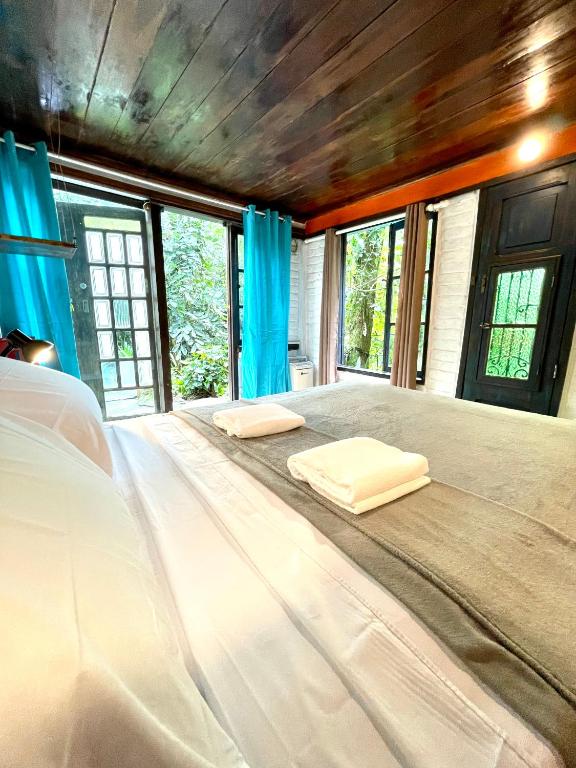 Cama ou camas em um quarto em Casa Selva - Vila do Abraão - Ilha grande