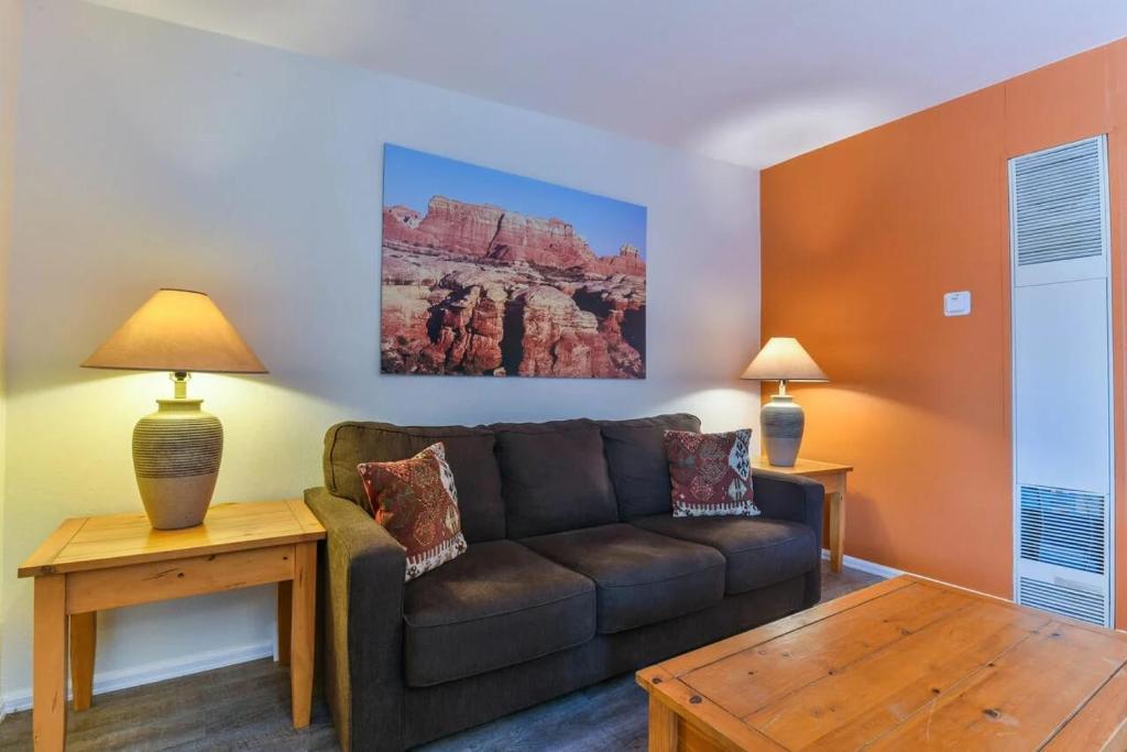 a living room with a couch and a table at Charming 2 Bedroom Near Downtown - Rose Tree 1 in Moab
