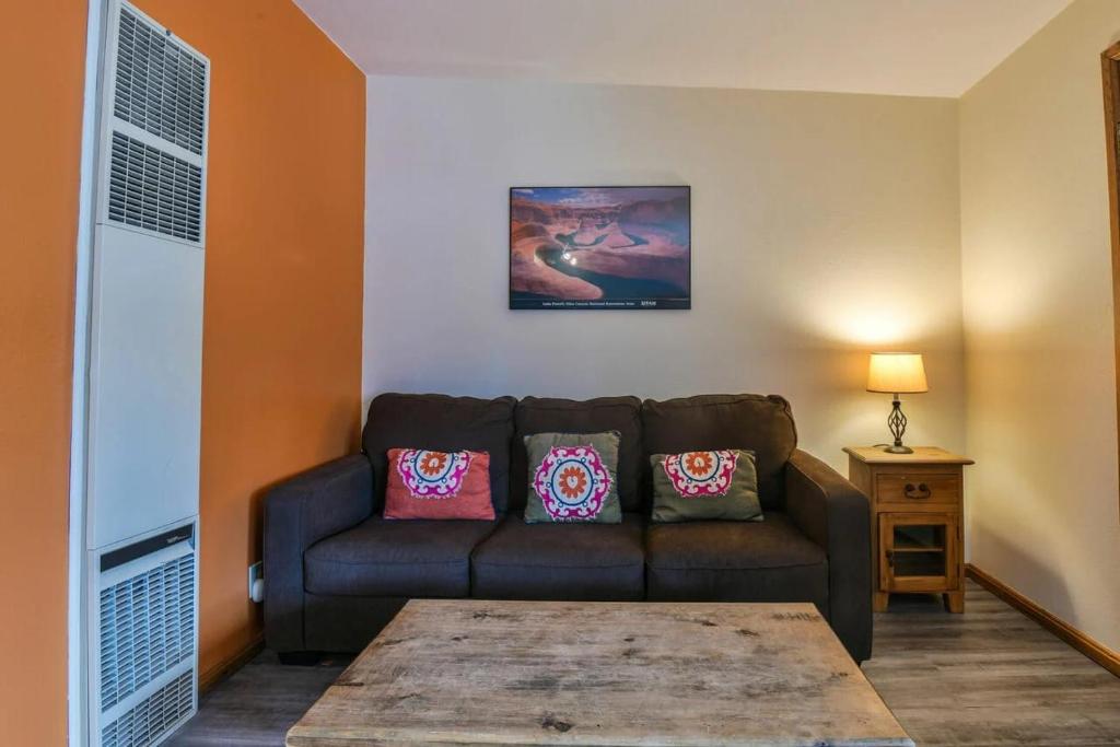 a living room with a couch and a table at Cozy Adventure Pad Near Downtown - Rose Tree 2 in Moab