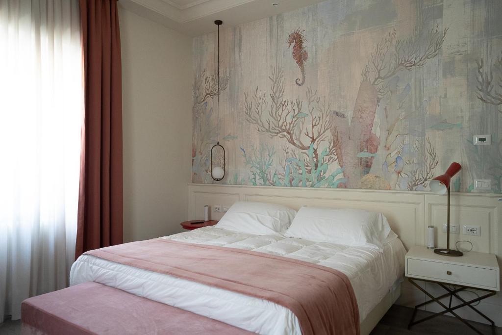 Łóżko lub łóżka w pokoju w obiekcie Hotel Bellonda