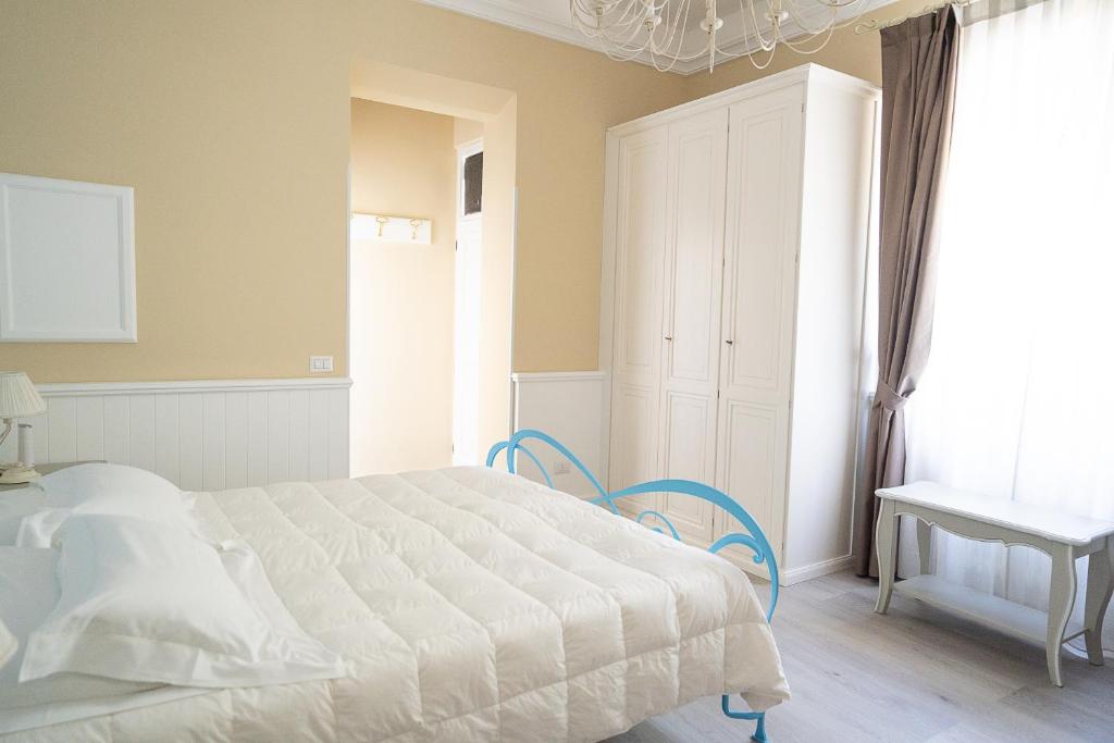 Łóżko lub łóżka w pokoju w obiekcie Hotel Bellonda