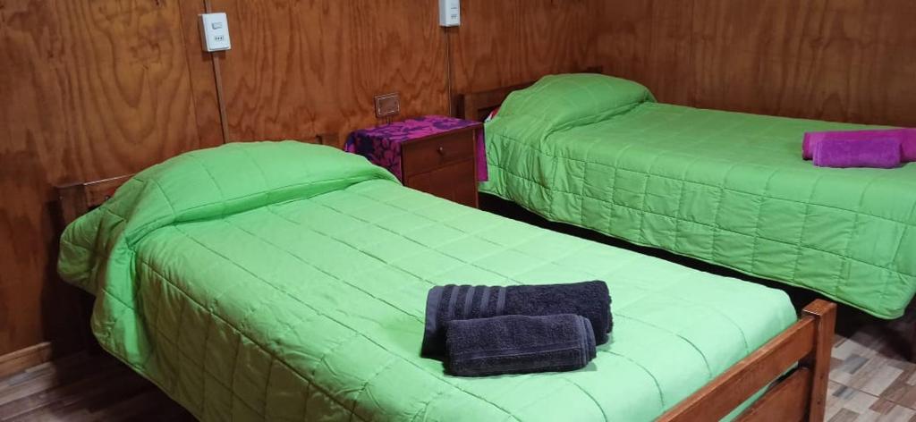 Letto o letti in una camera di Cabañas & Hostal Tojika