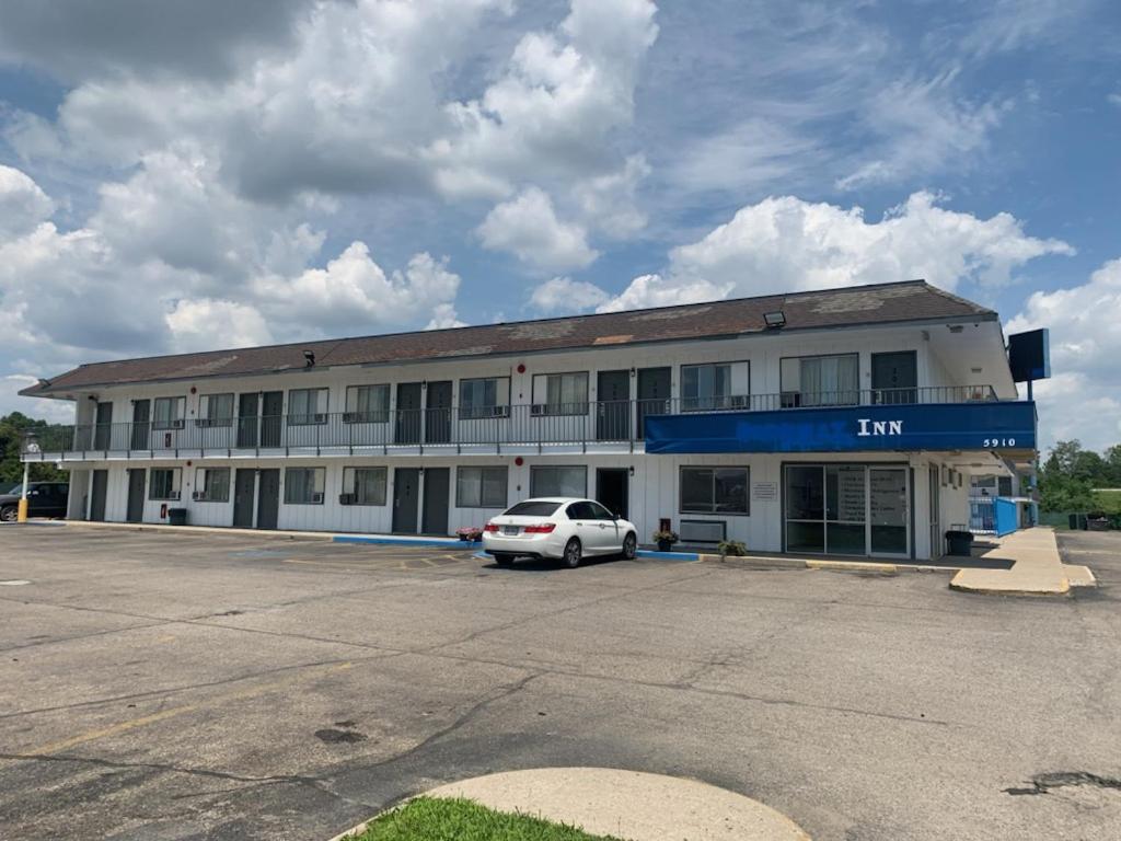 a white car parked in front of a building at Loyalty Inn Columbus in Brice