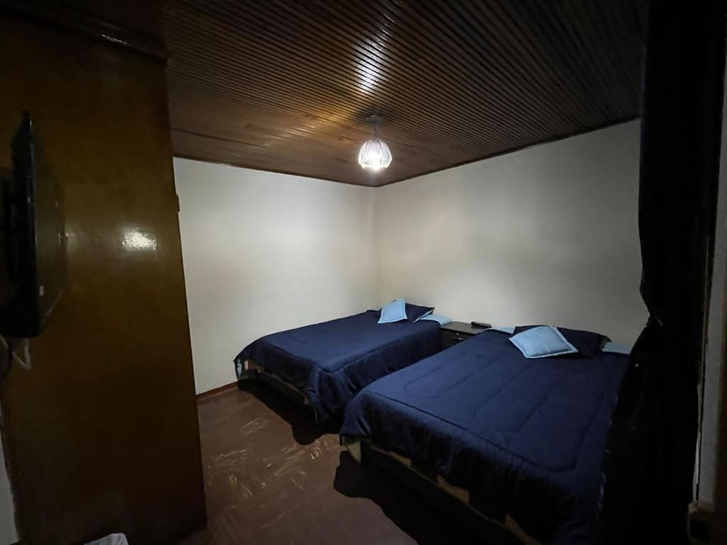 Postel nebo postele na pokoji v ubytování Casa Esther