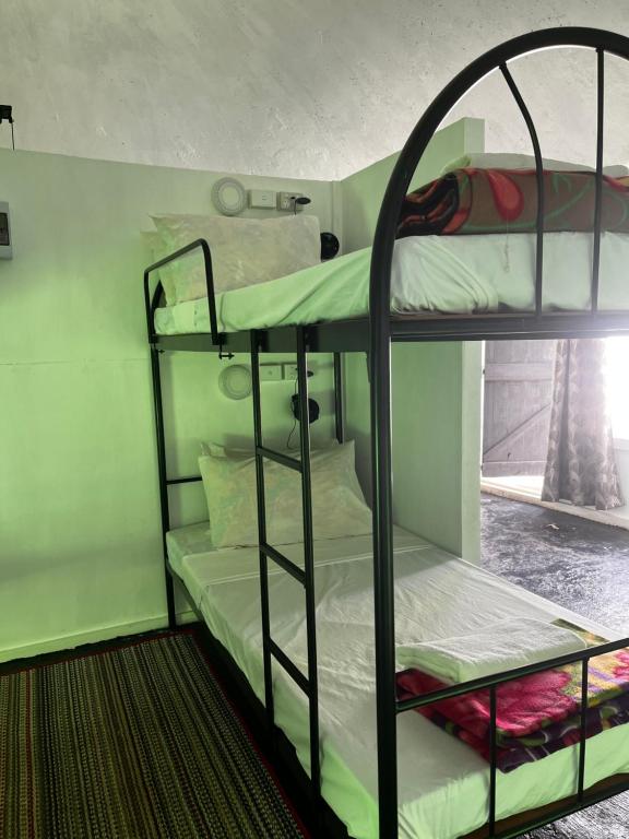 Postel nebo postele na pokoji v ubytování Camp Taveuni