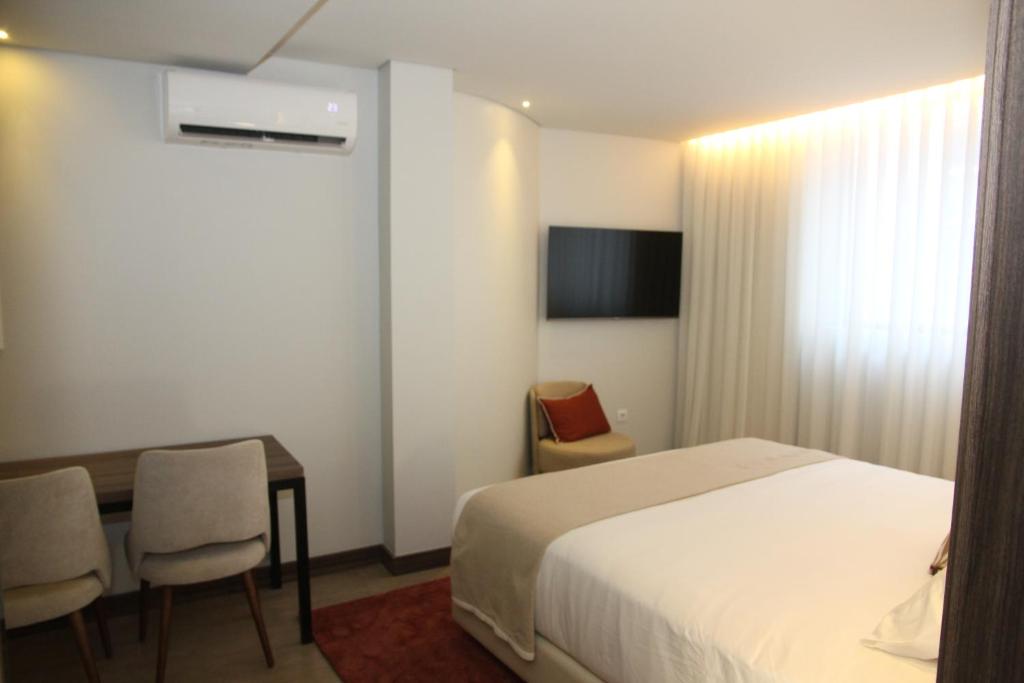 Postel nebo postele na pokoji v ubytování BrandApartments