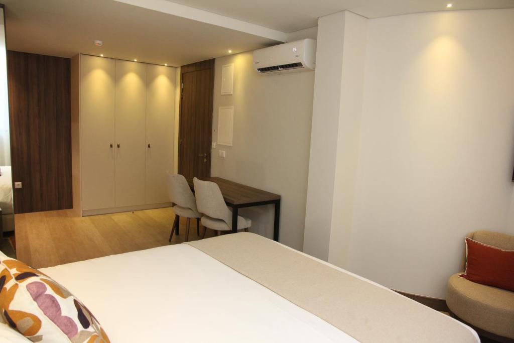 Postel nebo postele na pokoji v ubytování BrandApartments