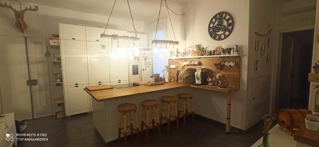 a kitchen with a counter and stools in it at Next to station for Florence in Montelupo Fiorentino