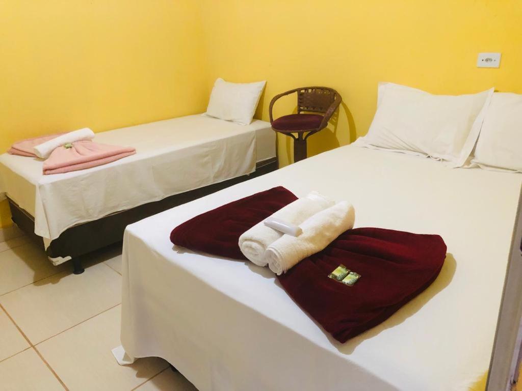 Uma cama ou camas num quarto em Pousada Voadores Jalapão