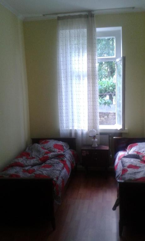 Postel nebo postele na pokoji v ubytování Lemon Family GuestHouse