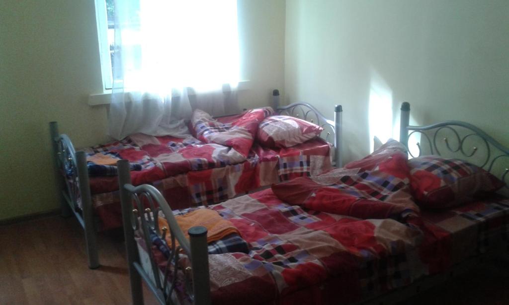 Postel nebo postele na pokoji v ubytování Lemon Family GuestHouse