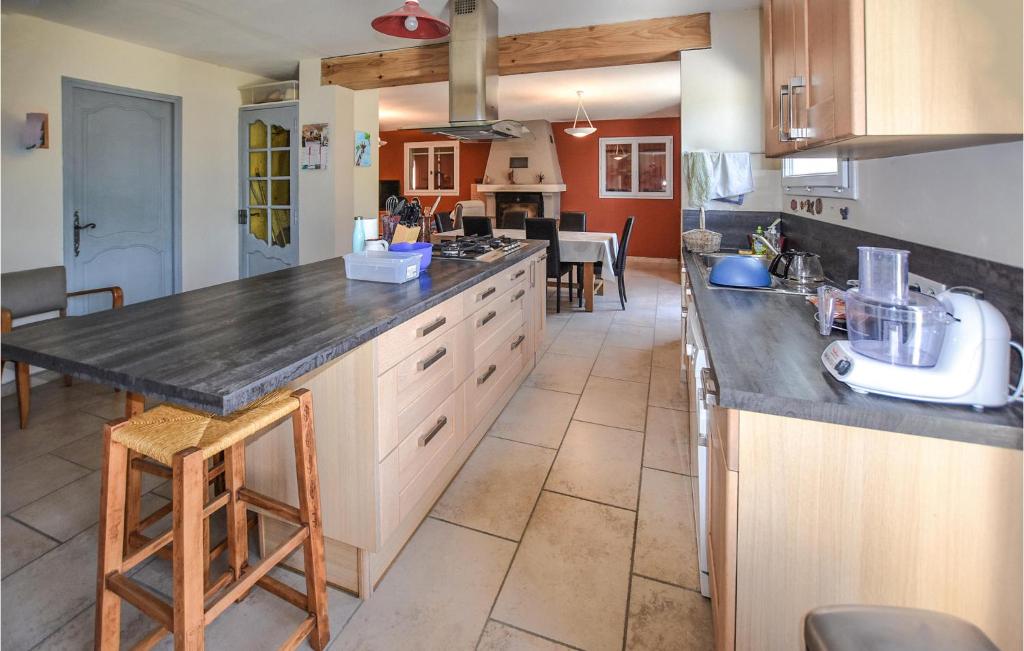 a kitchen with a large counter top in a room at Nice Home In Taulignan With Wifi in Taulignan