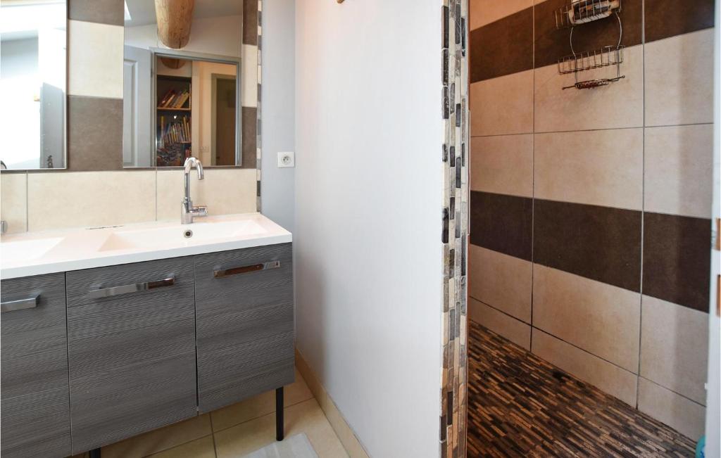 a bathroom with a sink and a shower at Nice Home In Taulignan With Wifi in Taulignan