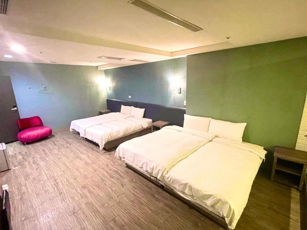 Postel nebo postele na pokoji v ubytování Walker Hotel - Zhengyi