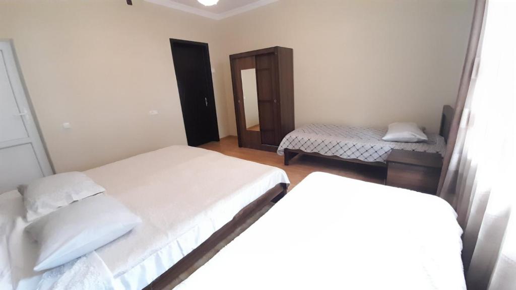 Postel nebo postele na pokoji v ubytování Guest House Gio