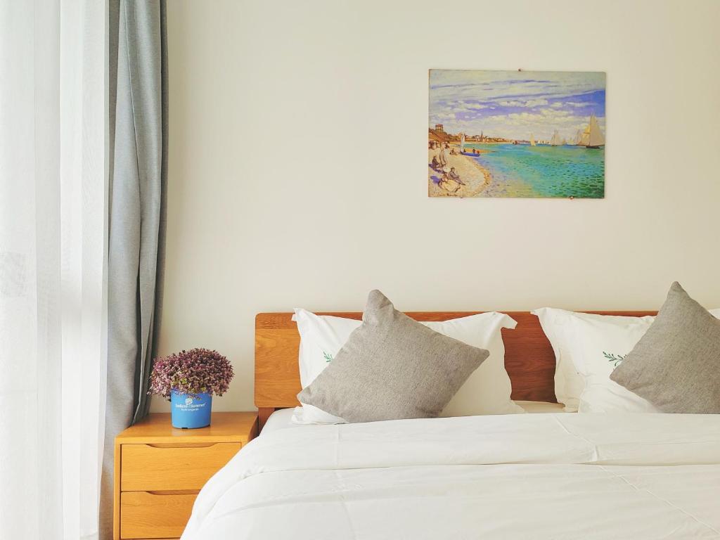 Postel nebo postele na pokoji v ubytování Moganshan Naicang Boutique Hotel