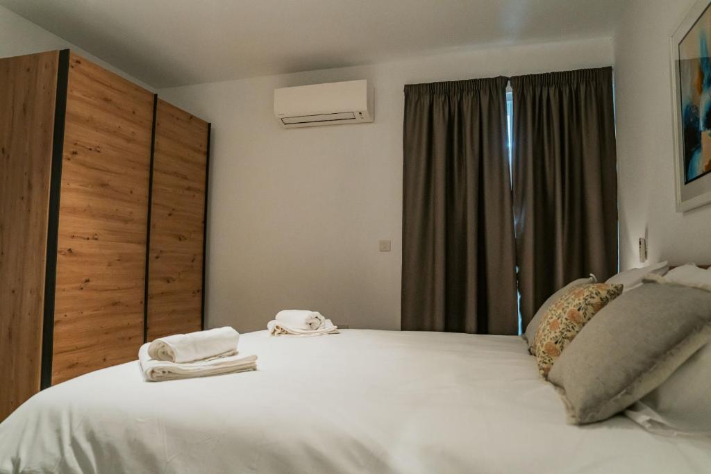 Postel nebo postele na pokoji v ubytování 86 Spinola Bay