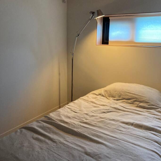 Postel nebo postele na pokoji v ubytování Stay JungEui
