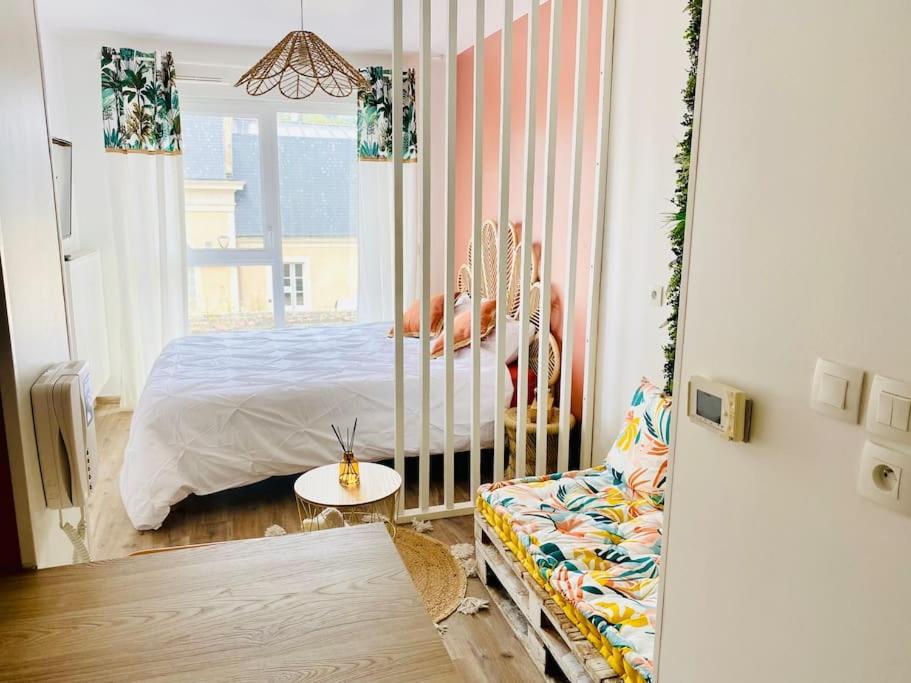 Ένα ή περισσότερα κρεβάτια σε δωμάτιο στο LAKAZ CREOLE - Caen Centre