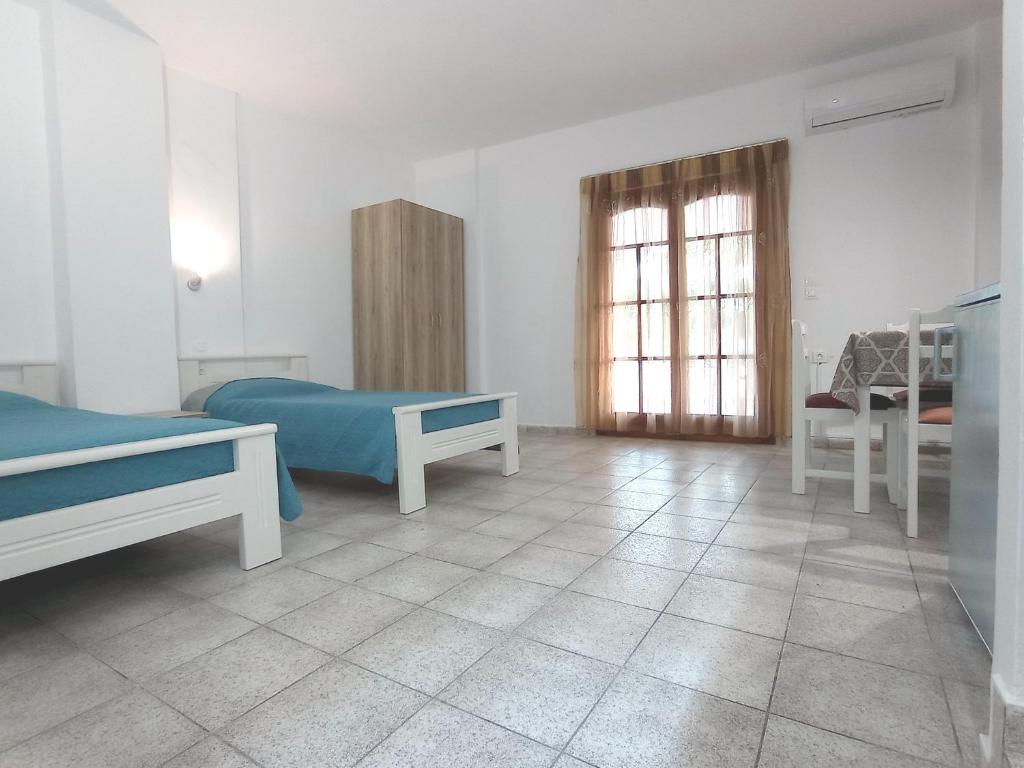 Postel nebo postele na pokoji v ubytování Flower Apartments