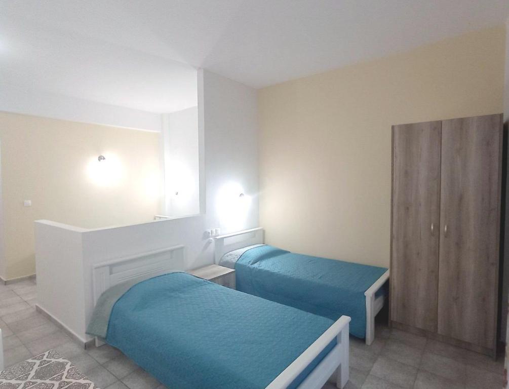 Postel nebo postele na pokoji v ubytování Flower Apartments