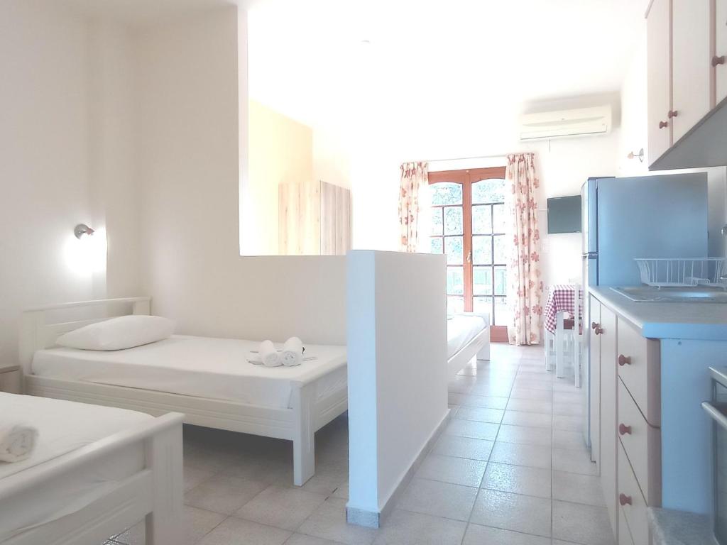Postel nebo postele na pokoji v ubytování Flower Apartments