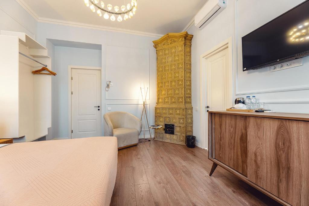 TV a/nebo společenská místnost v ubytování Boutique Hotel Manufactura