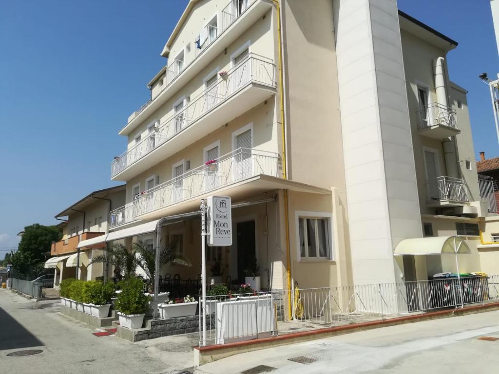a large building with a no parking sign in front of it at Hotel Villa Mon Reve in Rimini