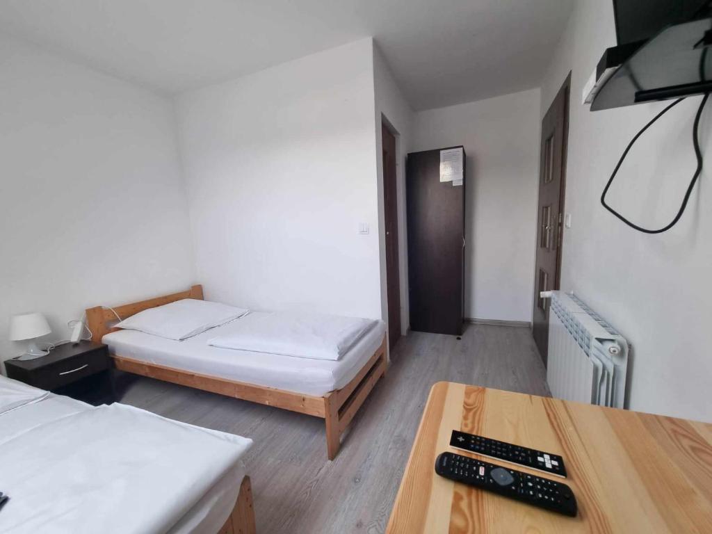 Postel nebo postele na pokoji v ubytování Willa Gazda