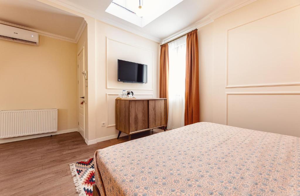 TV a/nebo společenská místnost v ubytování Boutique Hotel Manufactura