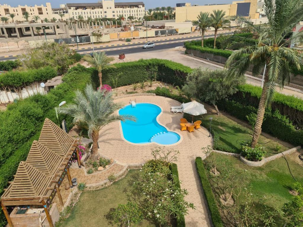 an aerial view of a resort with a swimming pool at Hurghada, mubark6 in Hurghada