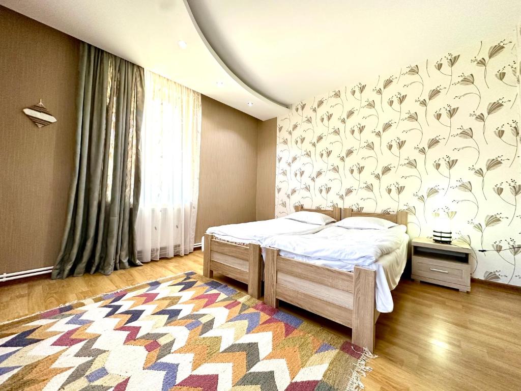 Llit o llits en una habitació de Guesthouse Mtkvari