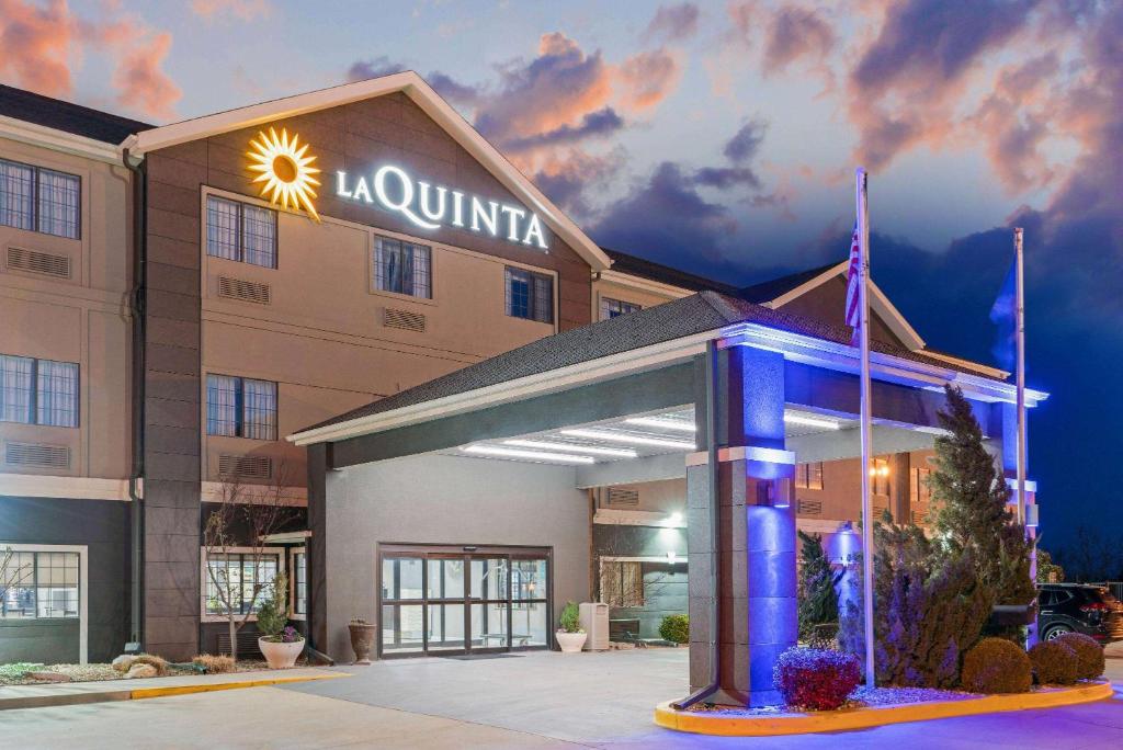 a rendering of a hotel with a lit up front at La Quinta by Wyndham Ada in Ada