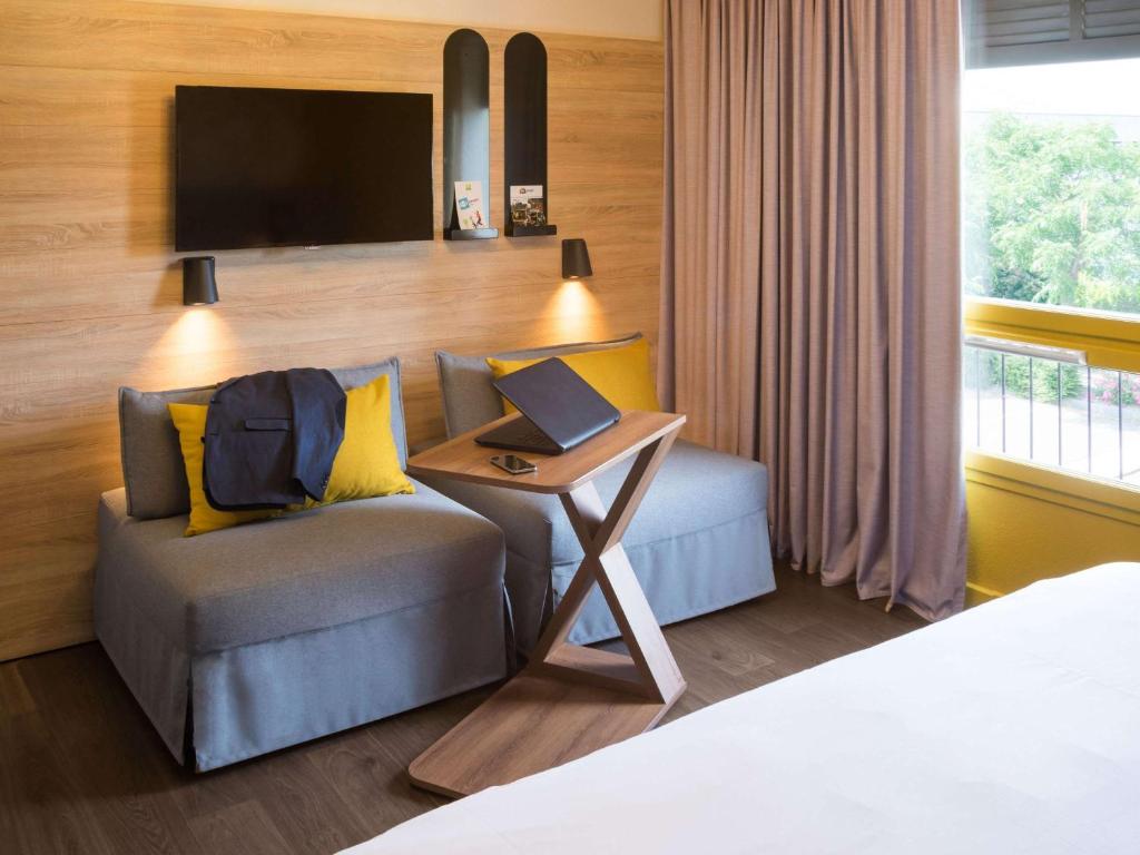 Postel nebo postele na pokoji v ubytování ibis Styles Carcassonne La Cité