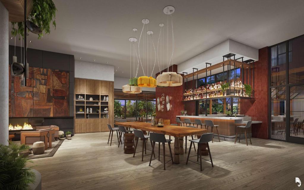 a rendering of a restaurant with a table and chairs at tommie Hollywood, part of Jdv by Hyatt in Los Angeles