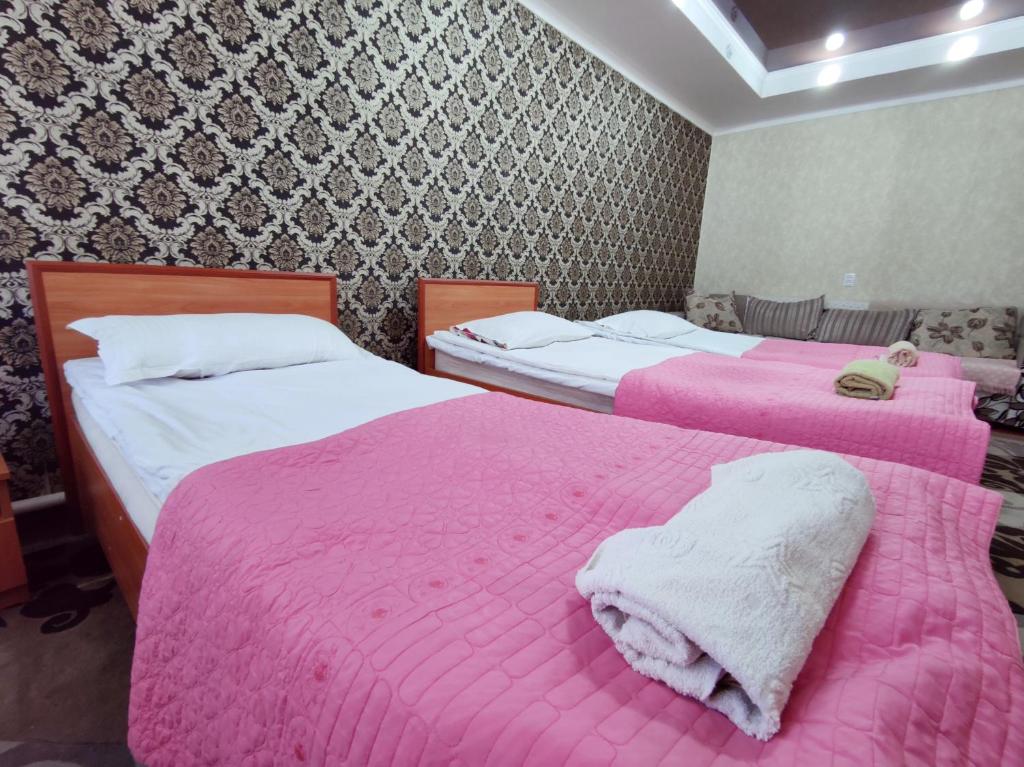 Postel nebo postele na pokoji v ubytování Guest House Adimi