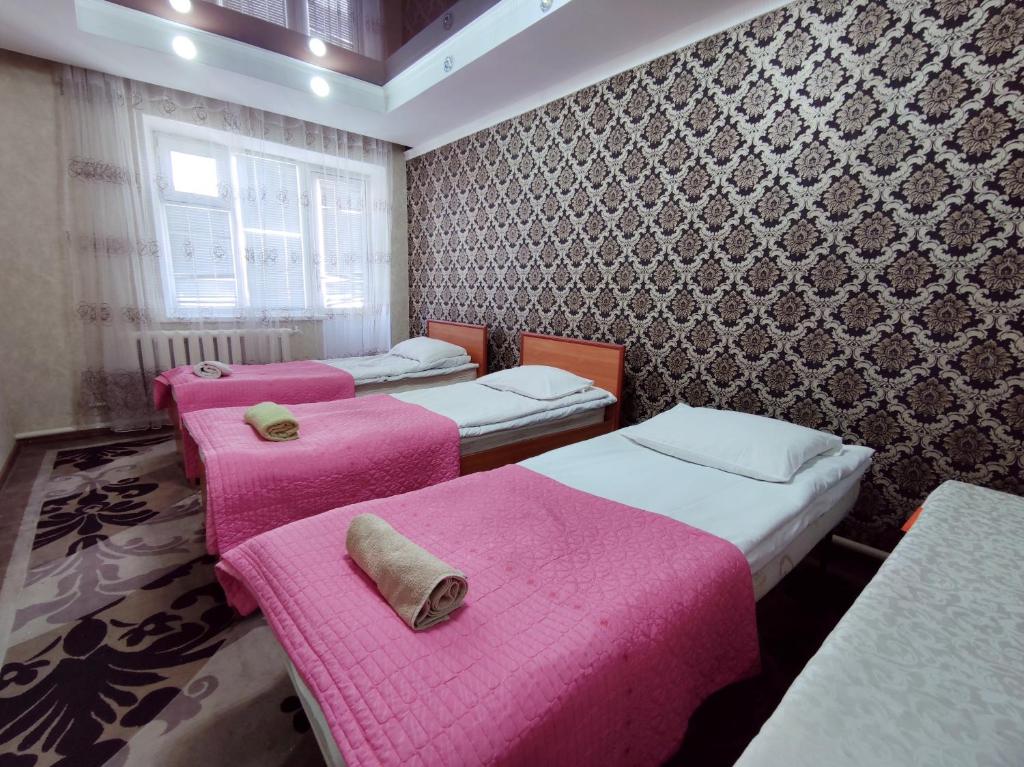 Postel nebo postele na pokoji v ubytování Guest House Adimi
