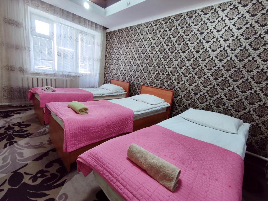 Postel nebo postele na pokoji v ubytování Guest House Adimi